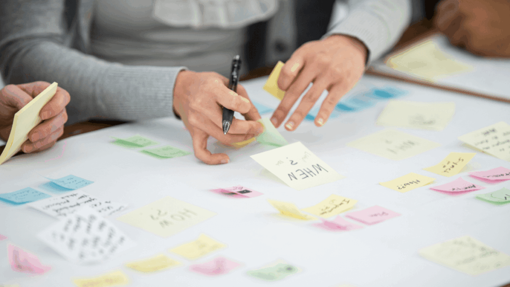 Sticky notes on a desk representing email content brainstorming and email strategy planning for an upcoming email marketing campaign.